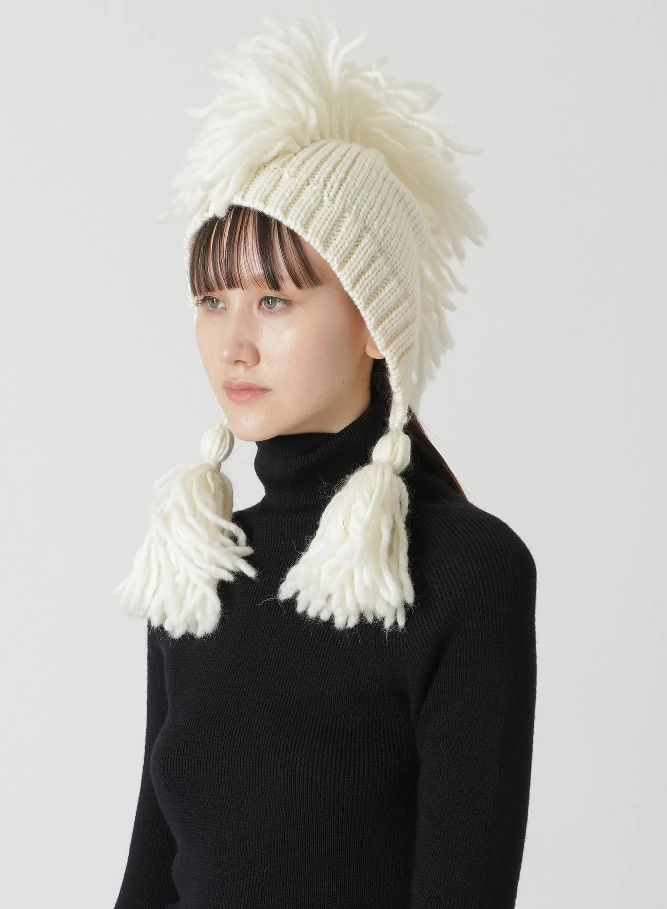 KNITTED WOOL JERSEY HAT WITH TASSELS AND SPIKES