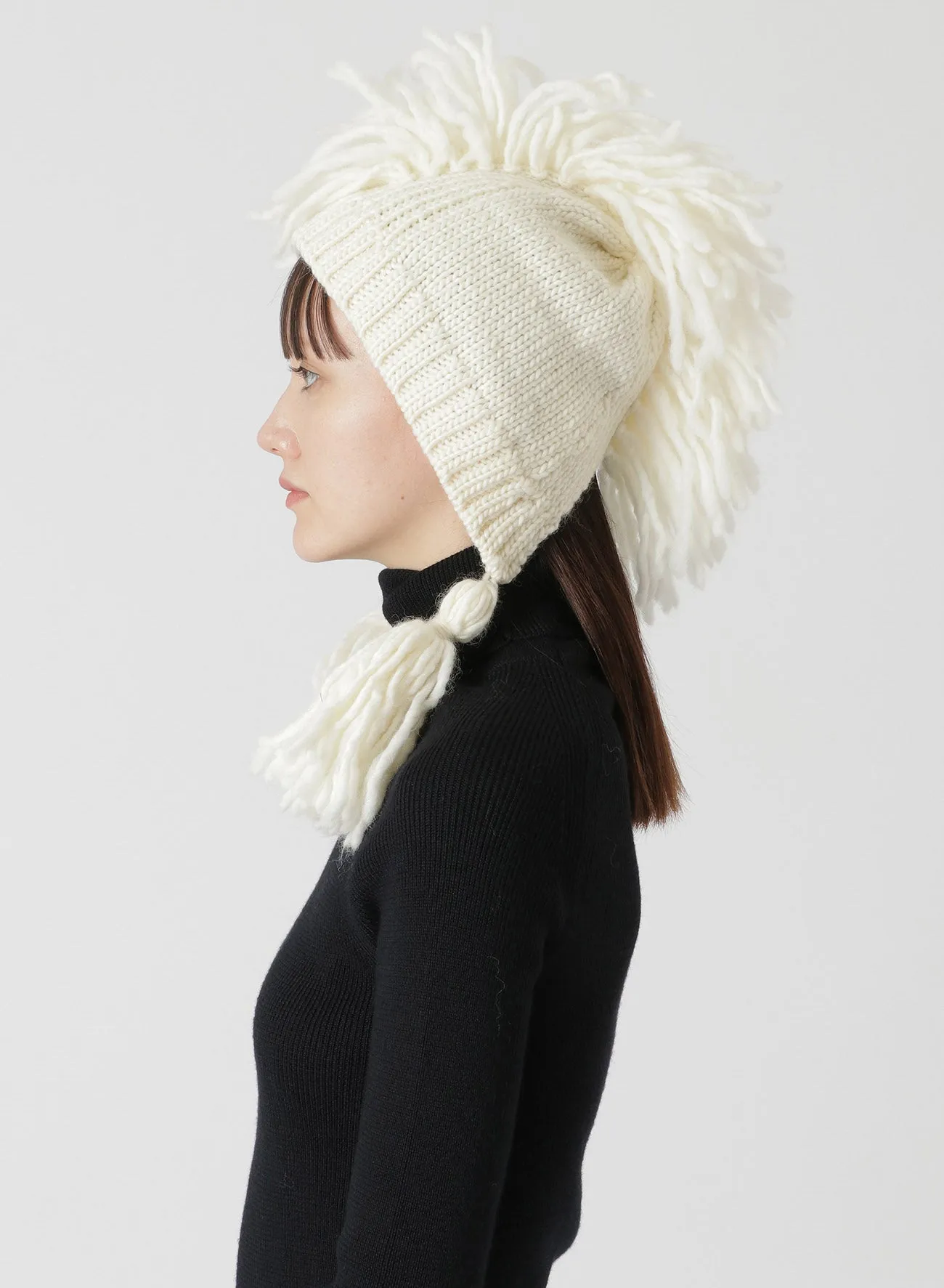 KNITTED WOOL JERSEY HAT WITH TASSELS AND SPIKES